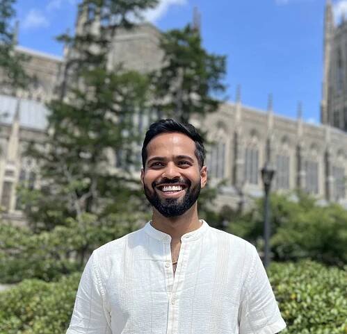 portrait of Mrinoy Banerjee in front of Duke Chapel