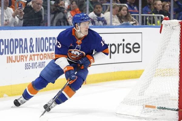 Mathew Barzal #13 of the New York Islanders skates behind the net during the first period at UBS Arena, Friday, Jan. 24, 2025, in Elmomt, NY. 