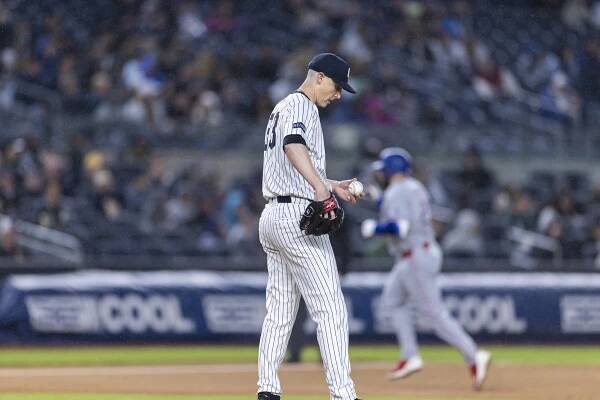 Yankees pitcher Ryan Yarbrough (33) gives up a home run to Texas Rangers’ Jake Burger (21) in the fifth inning