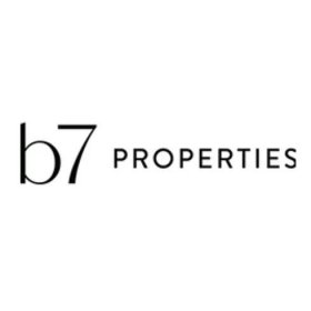 a black and white logo for b7 properties on a white background .