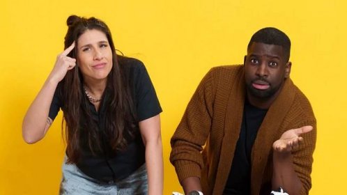 Two people, Louise Young and Inel Tomlinson, standing in front of a yellow background. Louise is pointing to her head like she has an idea, Inel is holding his hand out as if asking for help.