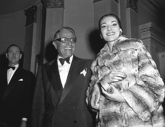 Black and White Photo of Aristotle Onassis and Maria Callas Smiling Standing Together 
