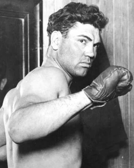 Jack Dempsey, victor, in the first radio-broadcast boxing match heard by an estimated 300,000 or more.