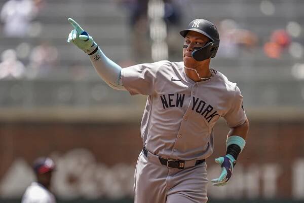 New York Yankees right fielder Aaron Judge (99) runs after hitting a home run against the Atlanta Braves during the first inning at Truist Park. 