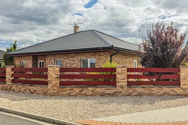 facade and fence made of facing bricks