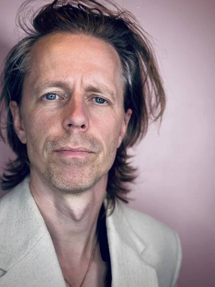 Professional headshot of Swedish actor Fredrik Wagner