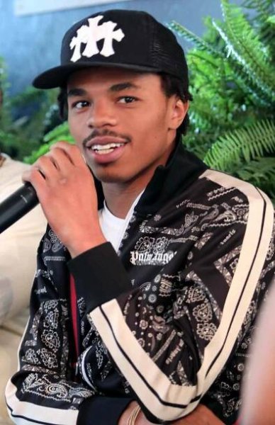 Joshua Marley speaking into a microphone