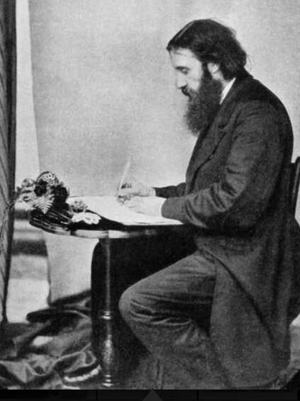George MacDonald at his writing desk, taken by Lewis Carroll.