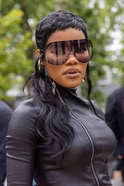 Teyana Taylor with a mullet haircut and sunglasses