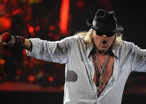 Axl Rose of Guns N' Roses performing on stage.