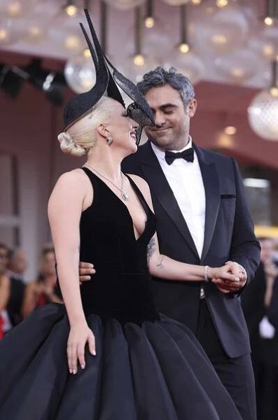 Lady Gaga and Michael Polansky attend the "Joker: Folie Ã  Deux" red carpet during the 81st Venice International Film Festival 