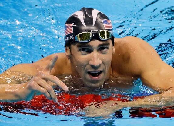 Michael Phelps returns to pool to race Baltimore Ravens players