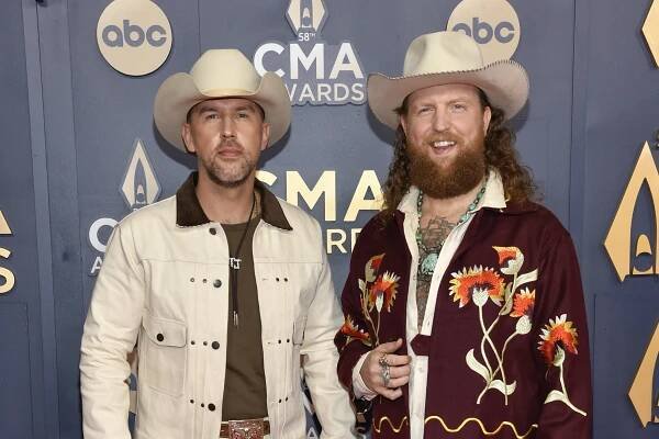 TJ Osborne, left, and John Osborne, of Brothers Osborne, arrive at the 58th Annual CMA Awards on Wednesday, Nov. 20, 2024