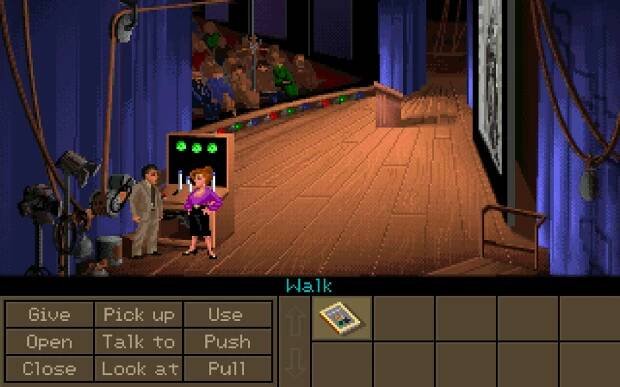 Screenshot of Indiana Jones and the Fate of Atlantis. Indy is meeting Sophia backstage at her presentation.