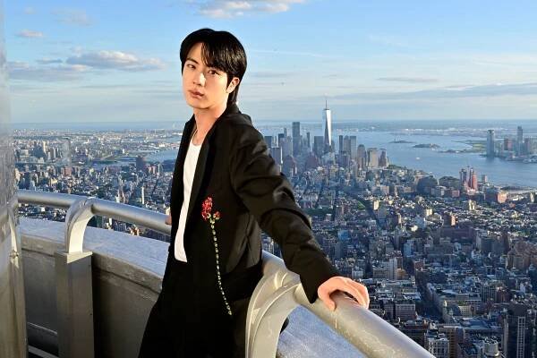 NEW YORK, NEW YORK - MAY 20: BTS' Jin lights the Empire State Building in celebration of his second solo album, Echo, on May 20, 2025 in New York City. (Photo by Eugene Gologursky/Getty Images for Empire State Realty Trust)
