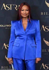 Garcelle teased her perky chest in her low-cut suit jacket, which she wore without a shirt underneath