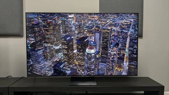 TCL C805 with aerial shot of city at night on screen 
