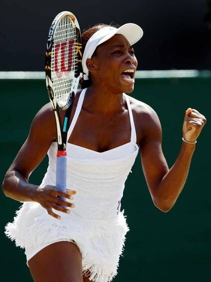 Venus Williams wearing a fringe skirt and white top