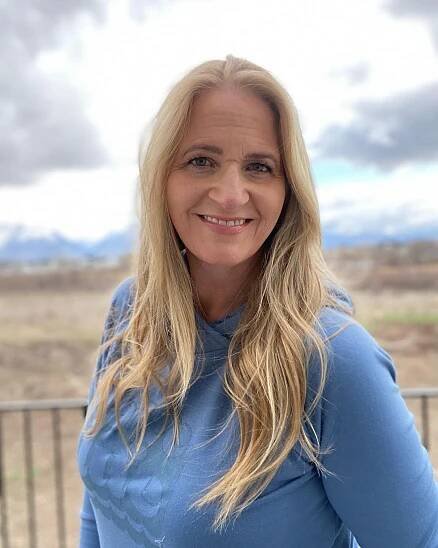 Christine Brown smiling for a photo.