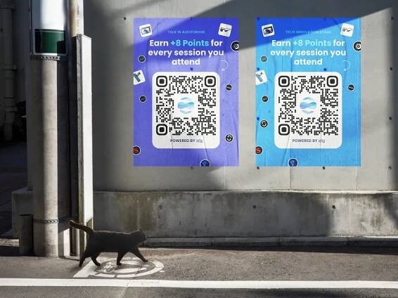 A cat walking on a street.