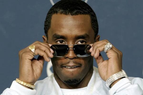 Sean "P. Diddy" Combs adjusts his sunglasses backstage at the Grammy Awards.