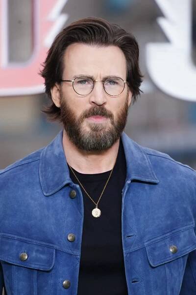 Chris Evans with long hair and a beard