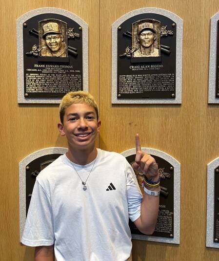 St. James-Smithtown Little League star Jeremy Katz points to his hero Craig Biggio's plaque at the Baseball Hall of Fame.