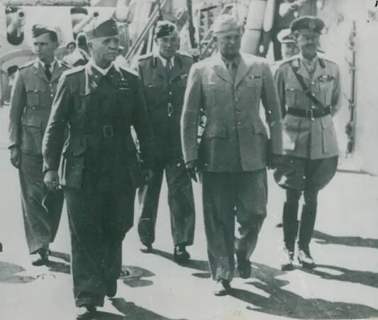 On deck of the battleship Nelson to sign the final armistice agreement. (L-R) Governor of Malta Lord Gort, Air Chief Marshal Arthur Tedder, Marshal Pietro Badoglio, Lt General Noel Mason-MacFarlane, General Dwight Eisenhower, Commodore Royer Dick (face only) and General Harold Alexander. Photos: National War Museum Association