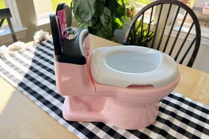The First Years Minnie Mouse Imaginaction Potty Chair on a table
