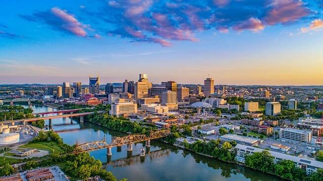 Aerial view of the Nashville skyline at sunset.