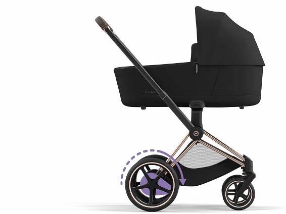 A modern black pram with a sleek design and sturdy frame.