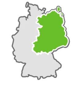 Eine stilisierte Deutschlandkarte auf der die neuen Bundesländer grün markiert sind.