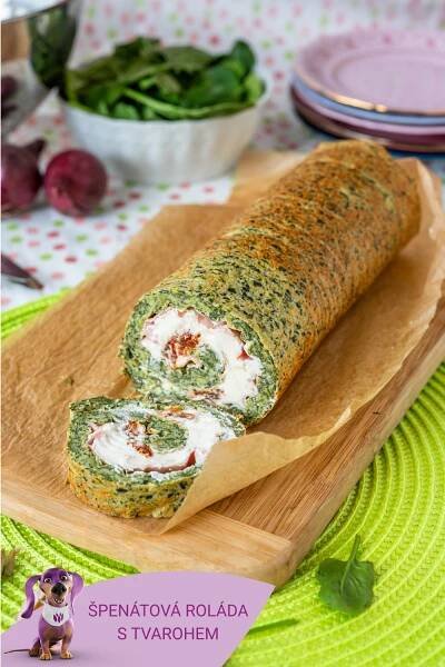 there is a roll with spinach and cream in it on a cutting board next to other food items