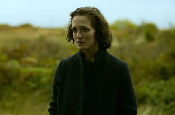 This image may contain Clothing Apparel Human Person Overcoat Coat Suit and Sleeve