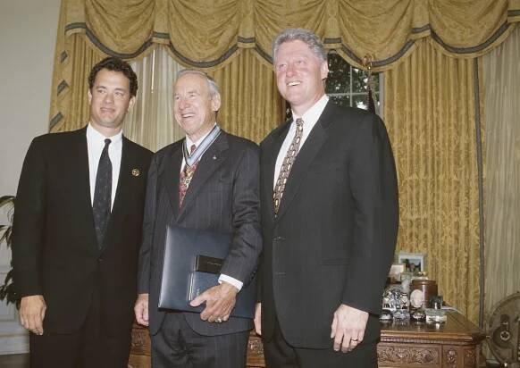 Tom Hanks standing next to Apollo 13 astronaut Jim Lovell and President Bill Clinton in 1995