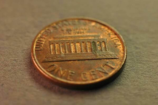 A close up of a penny on a table