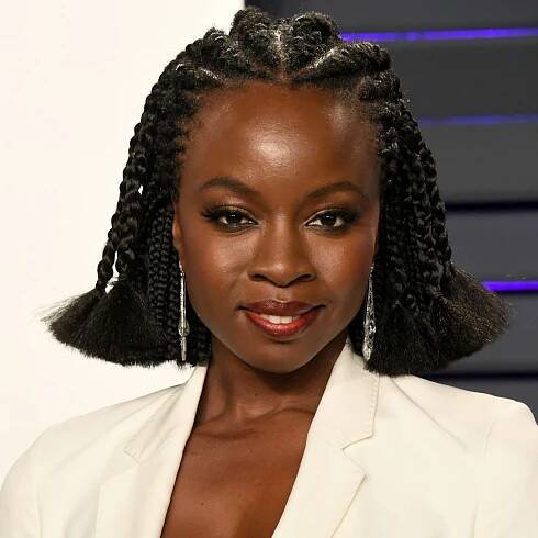 Danai Gurira with braids and frayed ends at the 2019 Vanity Fair Oscar Party in Beverly Hills, California