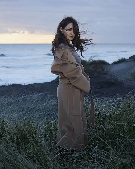 Nazanin Boniadi standing by the ocean