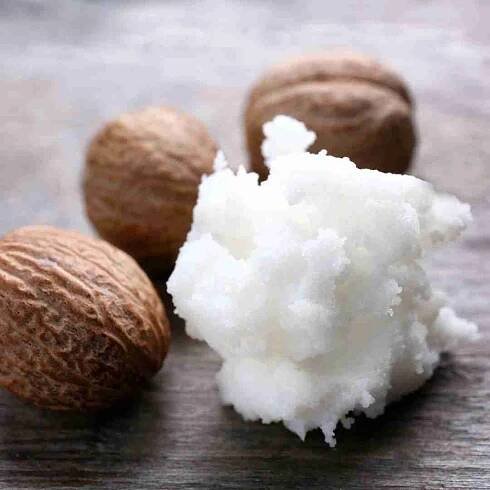 Shea Butter and Nuts on Table