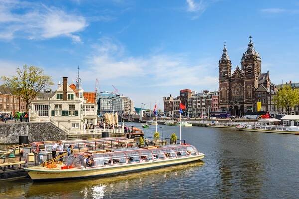 Sightseeng at Canal Boats near the Central Station of Amsterdam