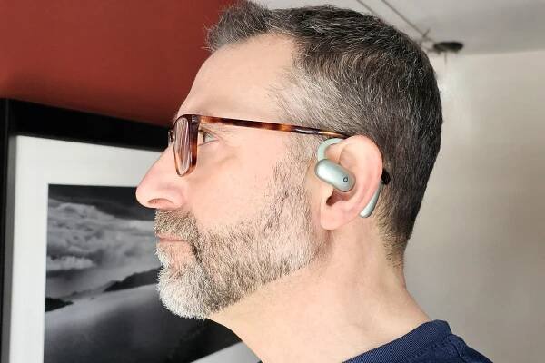 Simon Cohen wearing Soundcore AeroFit 2: side view.