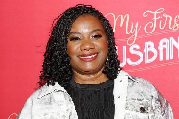 Adrienne C. Moore smiling and posing at the opening night of My First Ex-Husband.