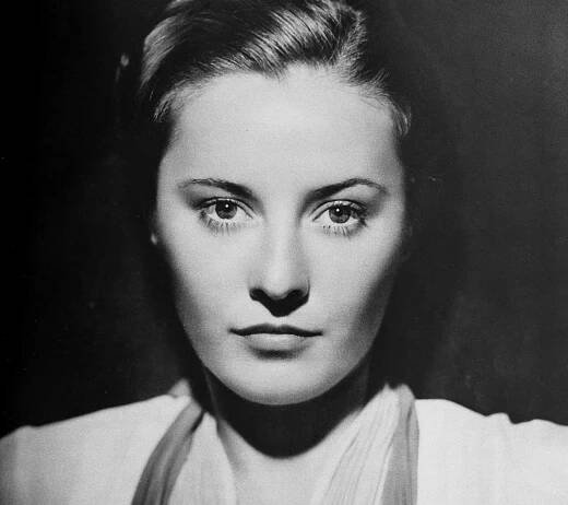 Portrait of Barbara Stanwyck by George Hurrell in light color top