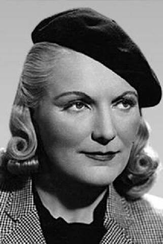a black and white photo of a woman with blonde hair wearing a beret hat
