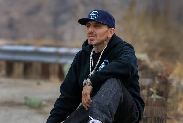 Ahmed Bellozo,48,on North Frontage Road in Highland, CA., near a homeless encampment January 30, 2025.