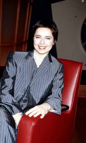 Isabella Rossellini Sitting In Red Leather Armchair.