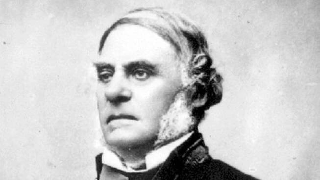 Black and white photograph of an imposing man in formal dress