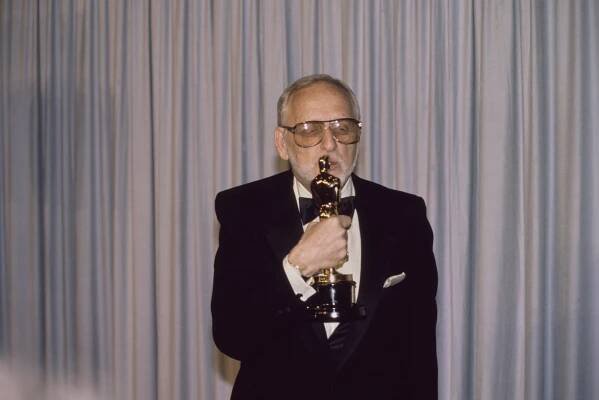 Robert Benton holding his 'Best Screenplay Written Directly for the Screen' award in the press room at the 57th Academy Awards on March 25, 1985