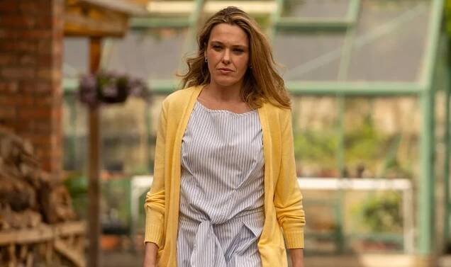 Zoe (Sally Bretton) in dress and yellow caridgan