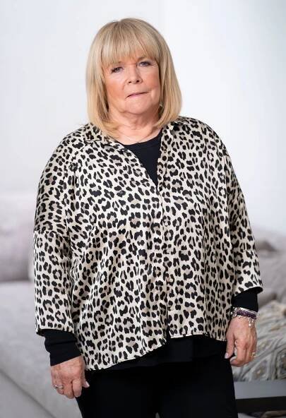 Linda Robson in a leopard print shirt.